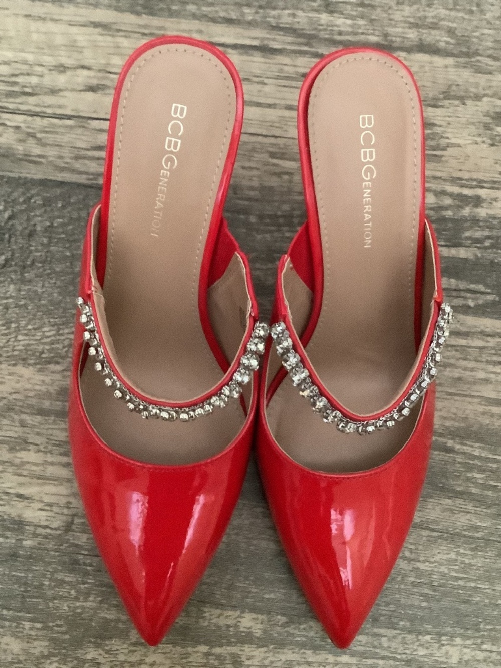 Shoes BCBGeneration red stiletto mules with a pointed toe and a rhinestone strap